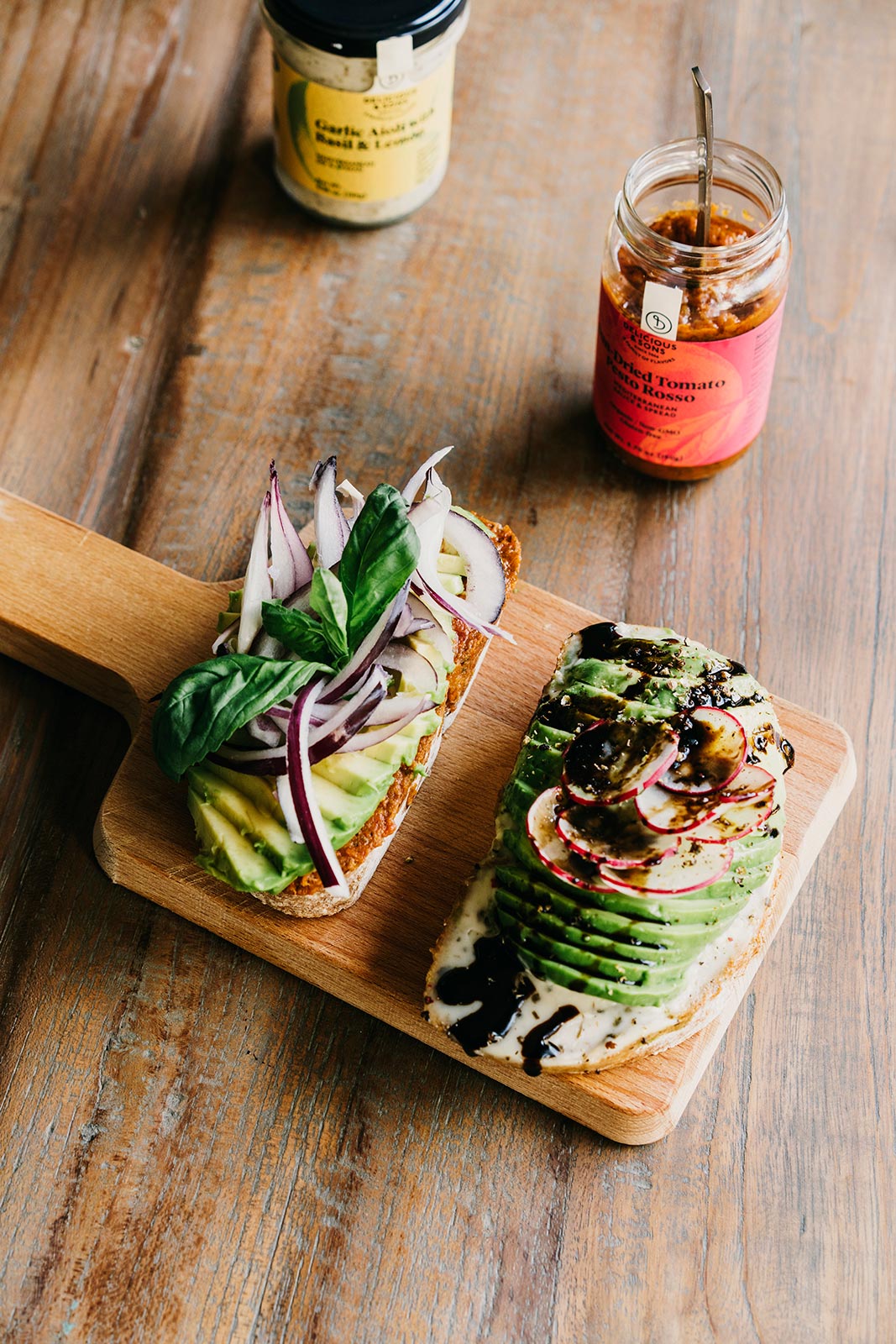 Avocado Toast with Sun-Dried Tomato Pesto Rosso, Red Onion, and Fresh Basil